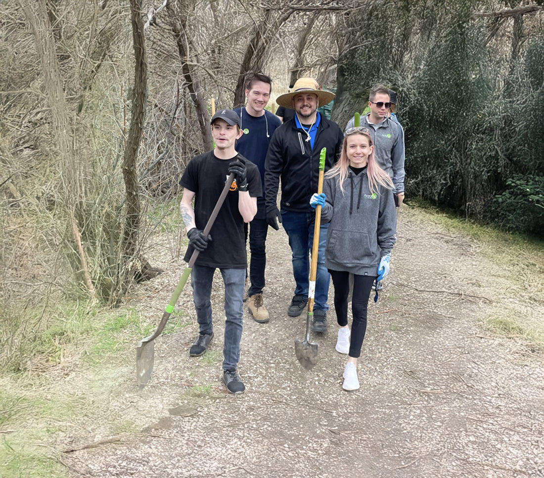 NuvoH2O team members with shovels on a trail work day