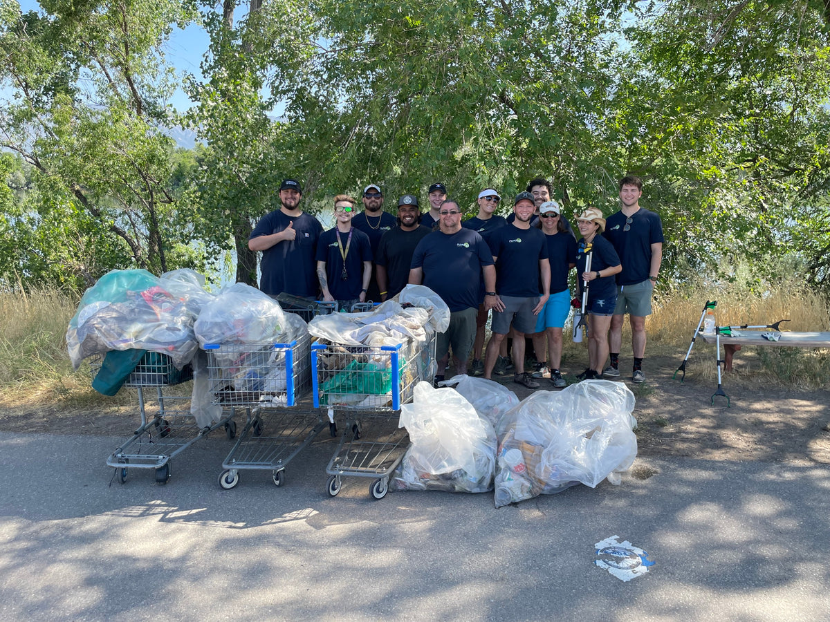 NuvoH2O team with bags of trash collected at a community cleanup