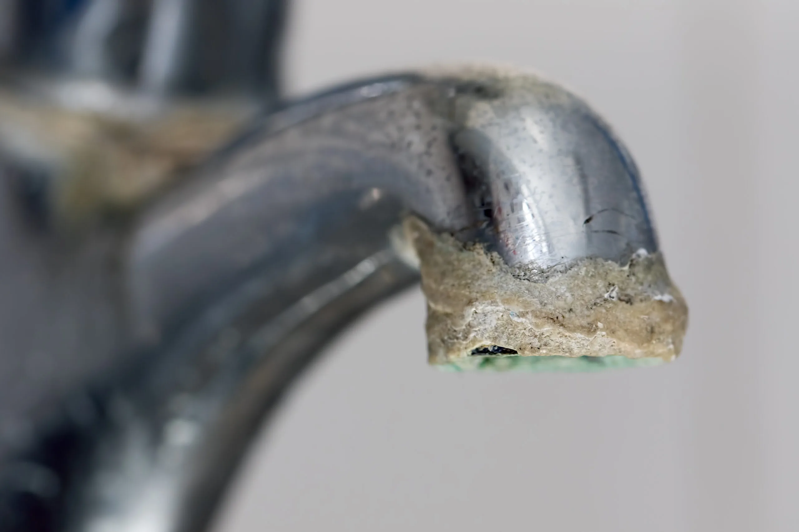 hard water buildup on a water faucet