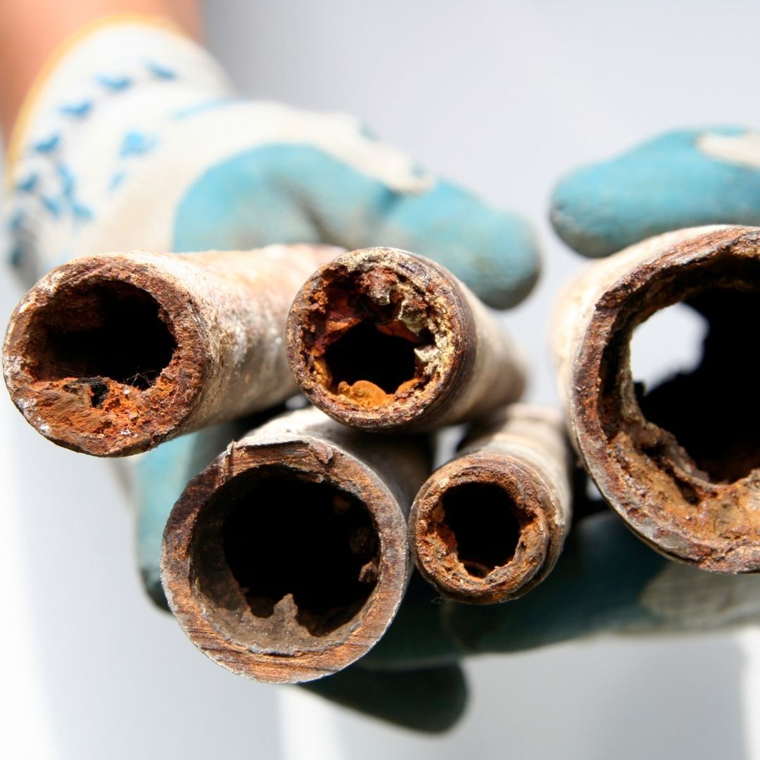 corroded metal pipes showing rust 