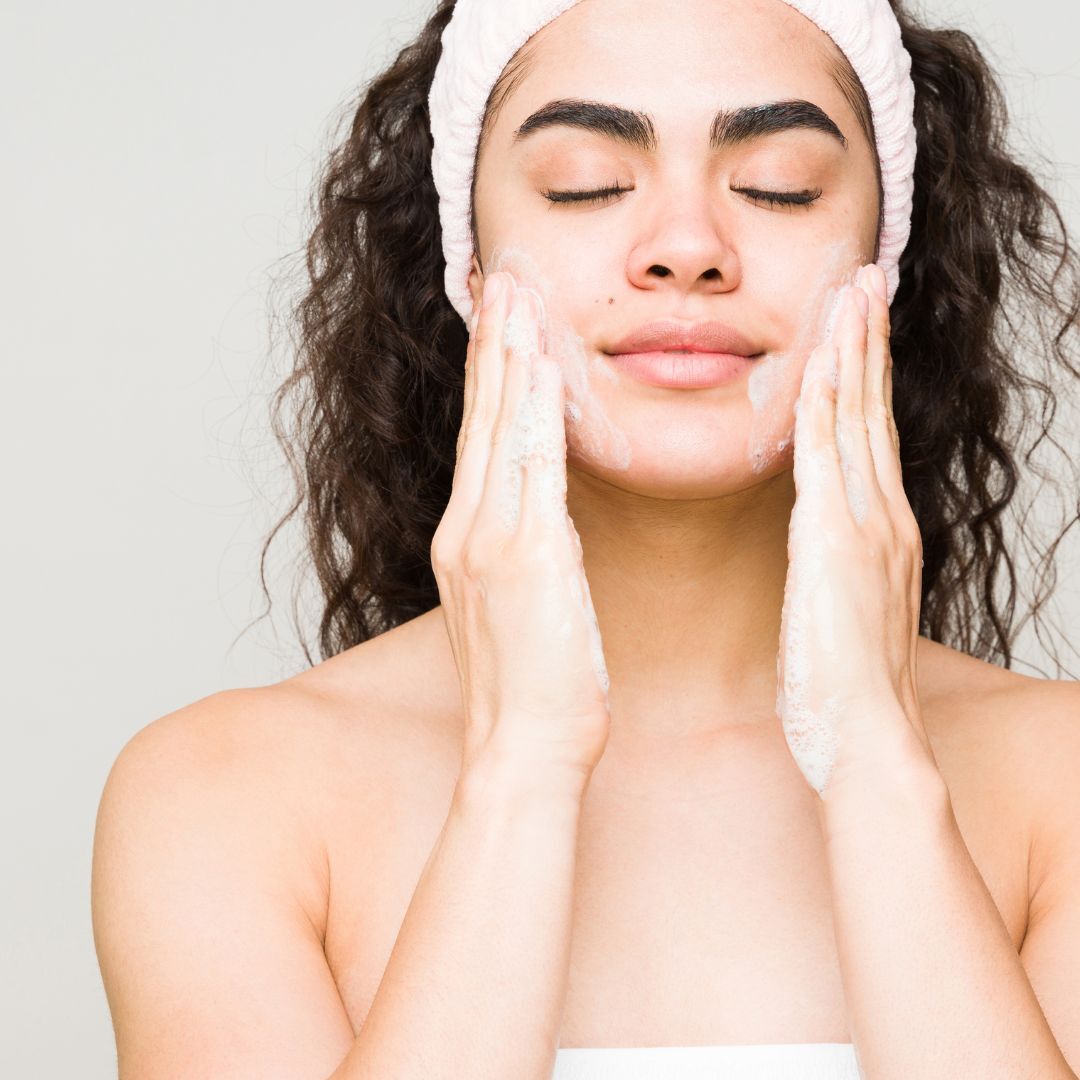 women rubbing her skin with eczema cream