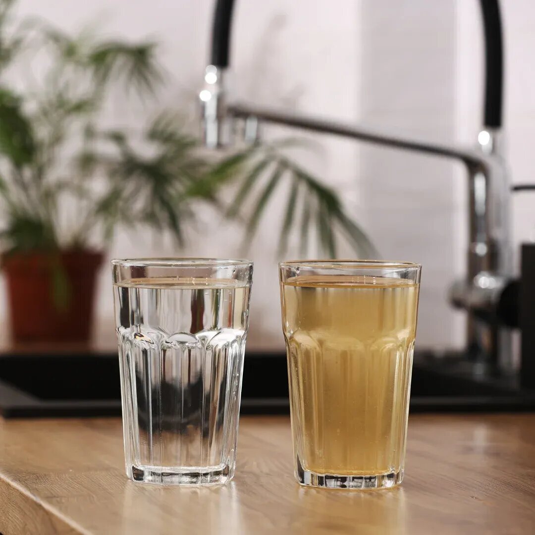 two glasses of water, one with clean water, the other with dirty sediment