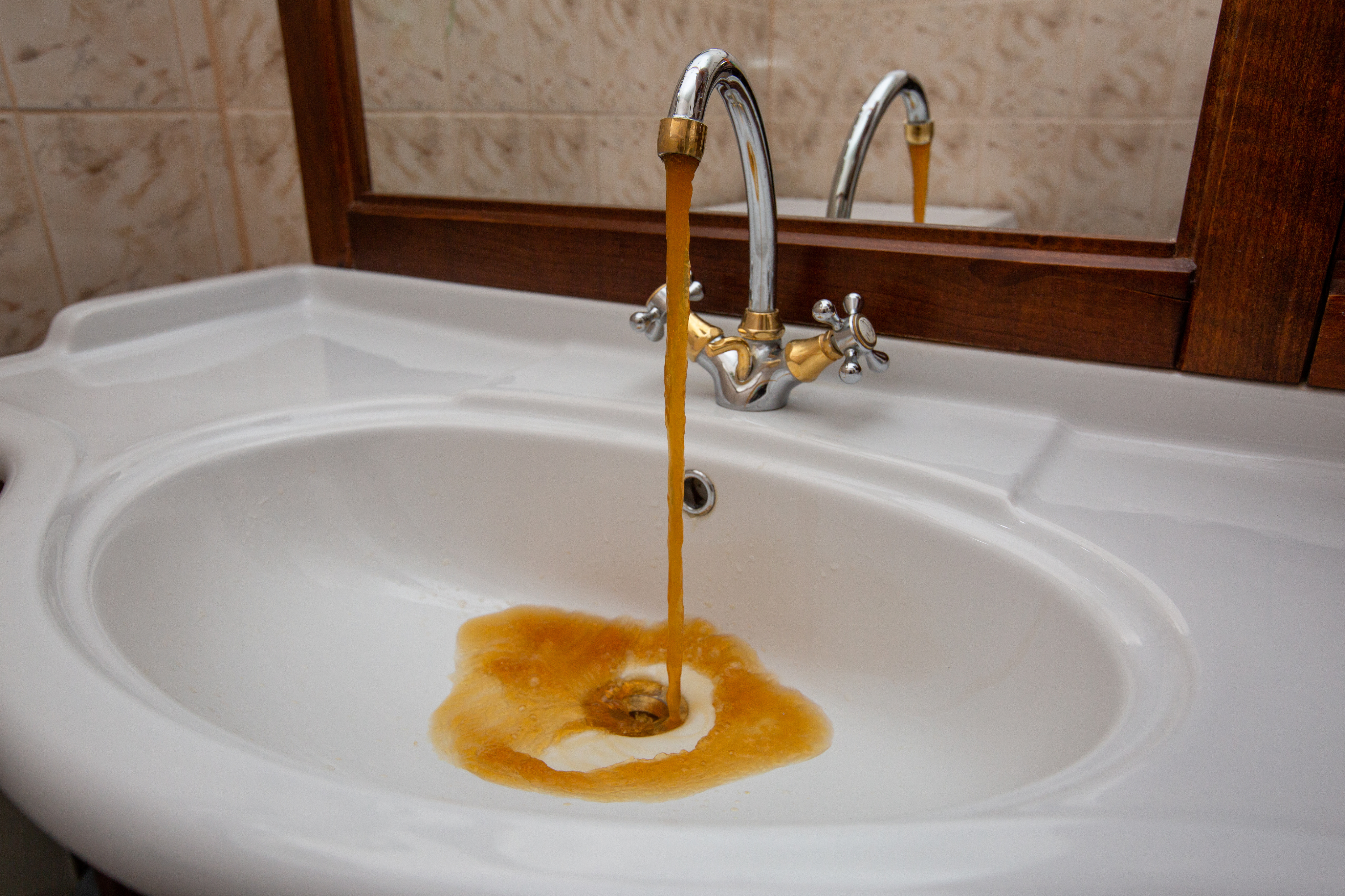 rust colored water due to hard water contamination