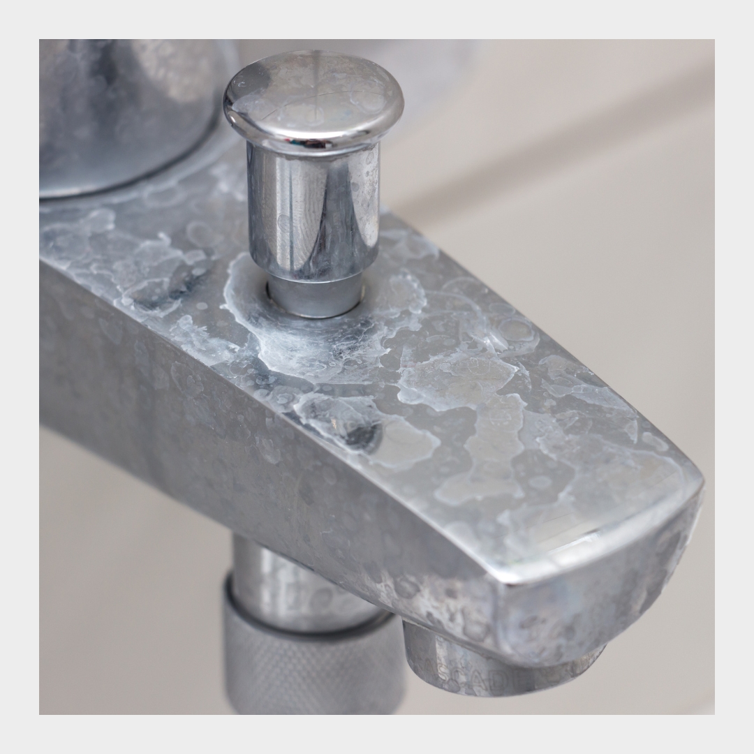 image of a faucet with lime scale on it