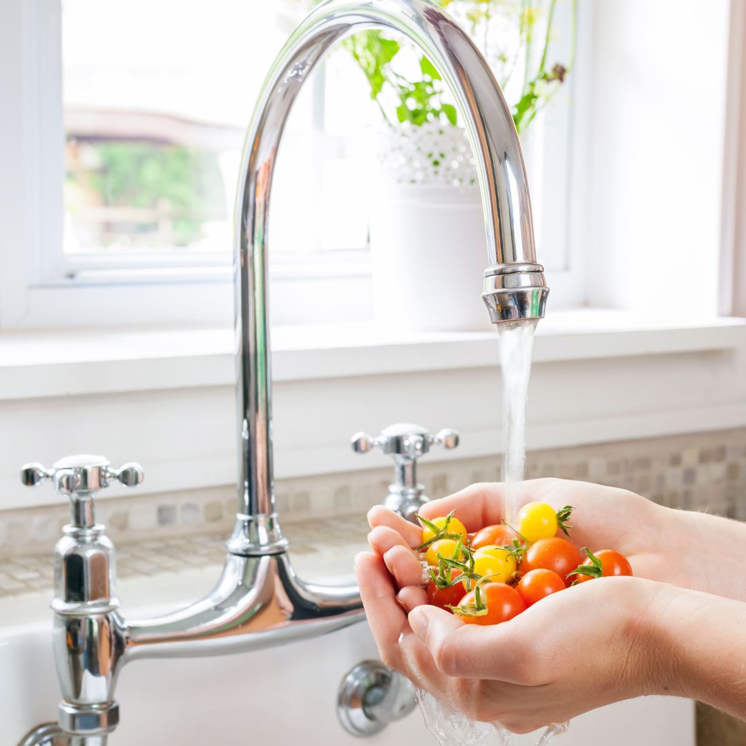 rinsing veggies in a sink