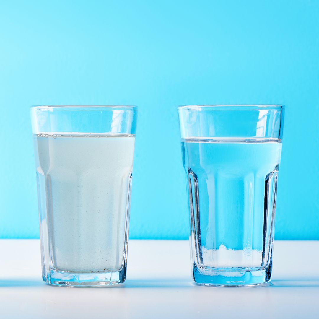 glass of foggy water next to glass of clear water