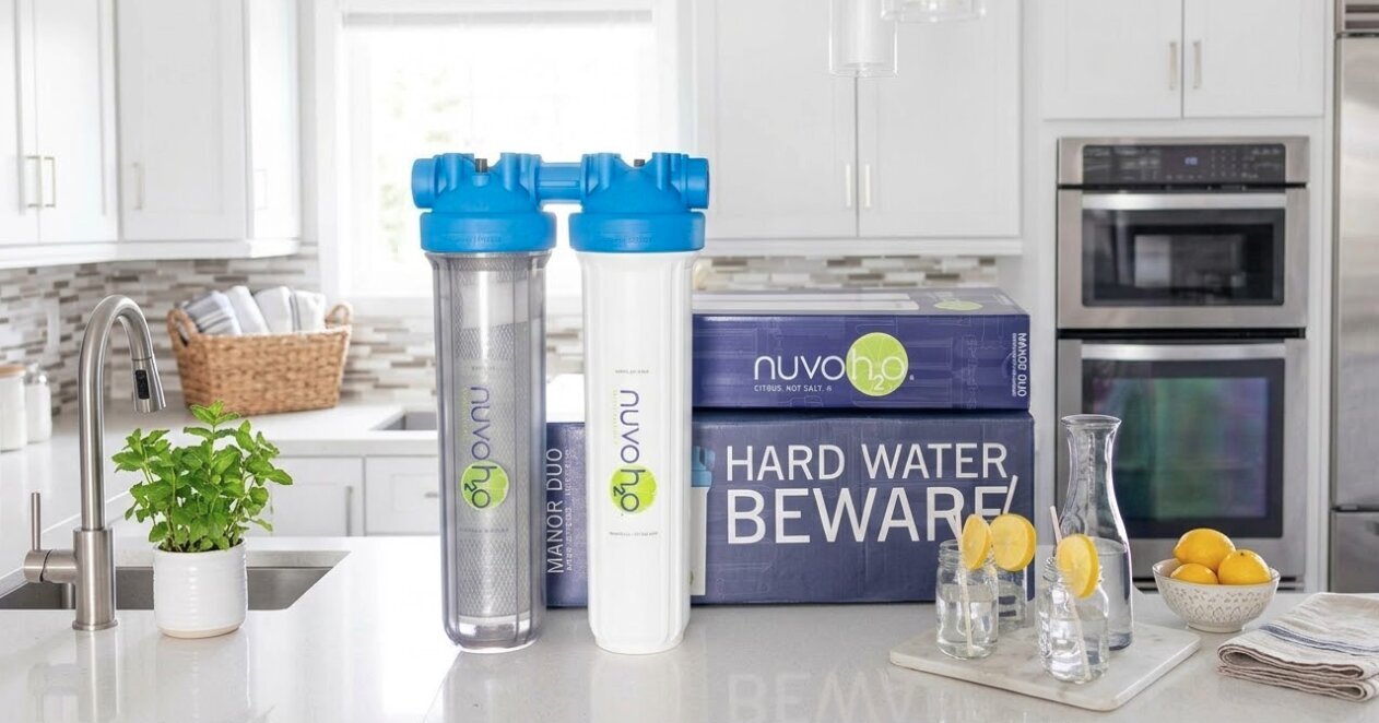 NuvoH2O Manor Duo salt-free hard water filter on a Lindon kitchen counter with fresh lemon water.