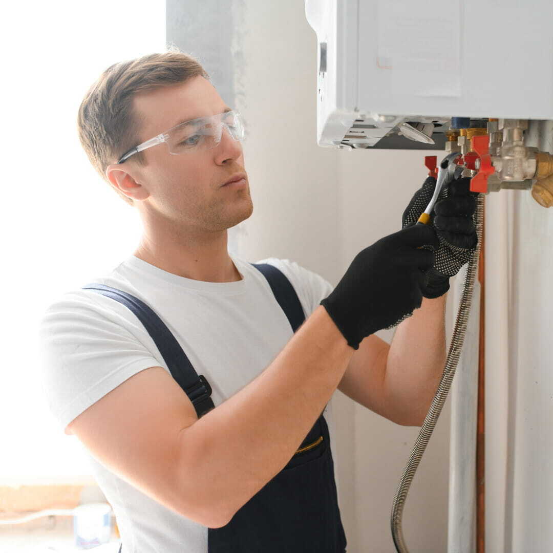 plumbing professional setting up a water softener